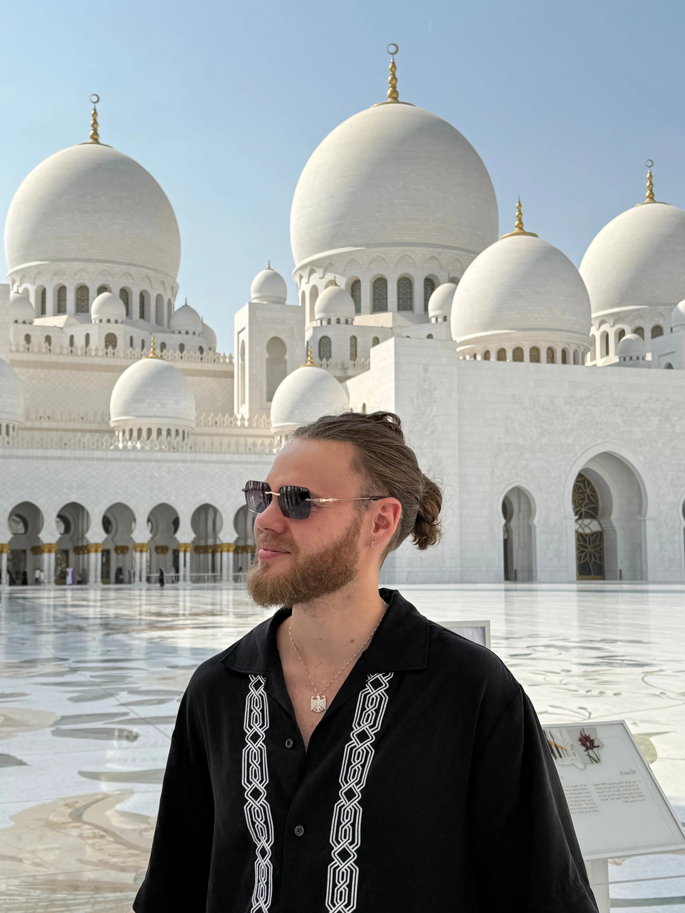 Wilhelm Treffer in a courtyard with white domed mosque architecture